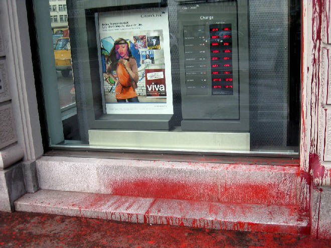 color bomb attack against swiss bank CREDIT SUISSE bank in zurich switzerland attacked with color bombs in january 2013. farbanschlag auf CREDITS SUISSE bankfiliale in zrich im januar 2013